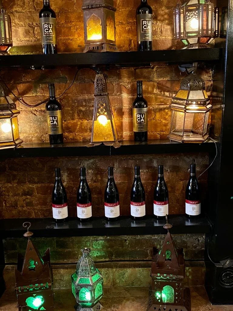 Wine cellar dining room with brass lanterns
